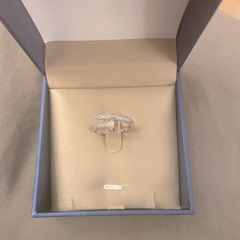 Stainless steel nail ring. With cz stones. Size 9- very gently used.